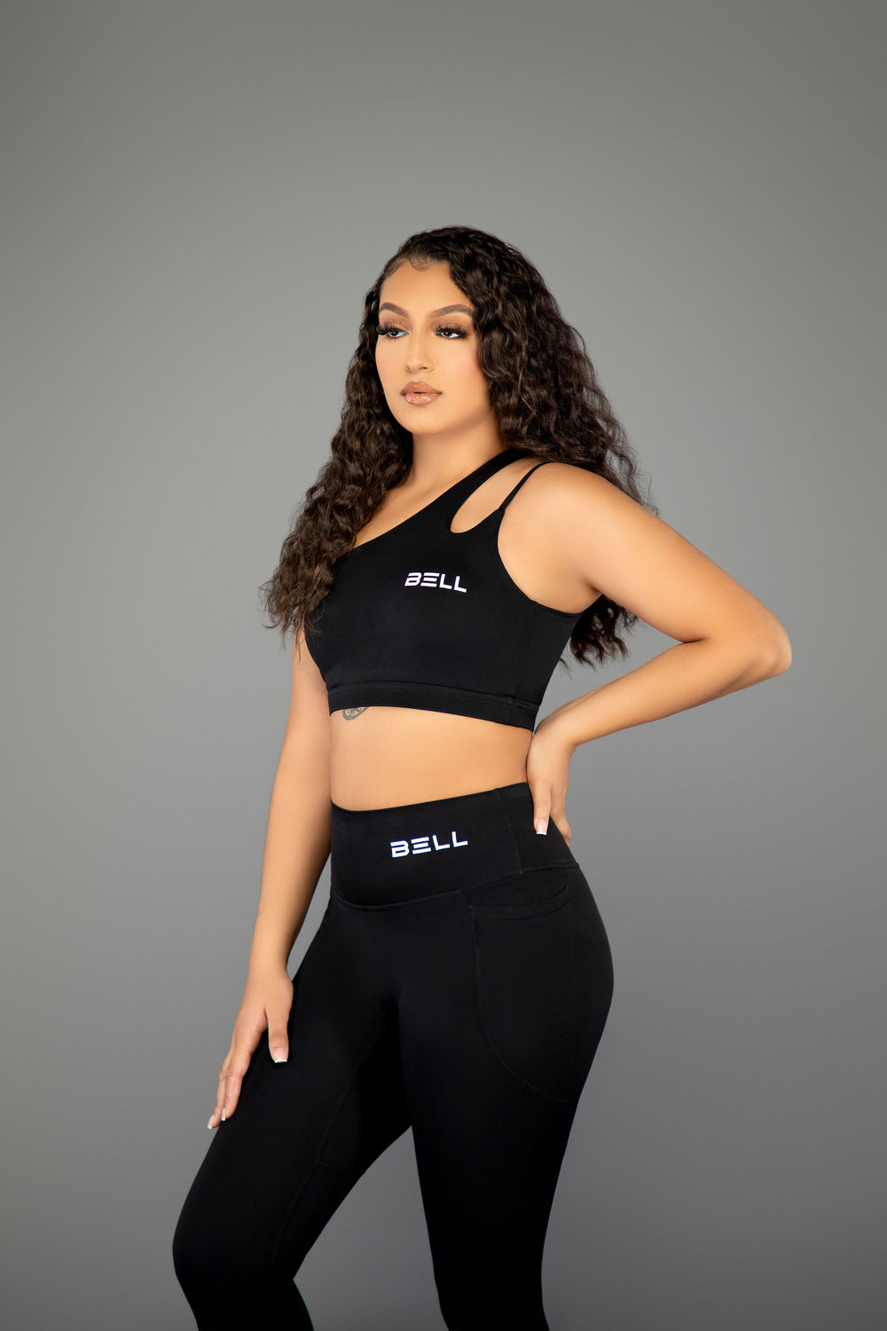 black gym leggings and sports bra set side view athletic wear